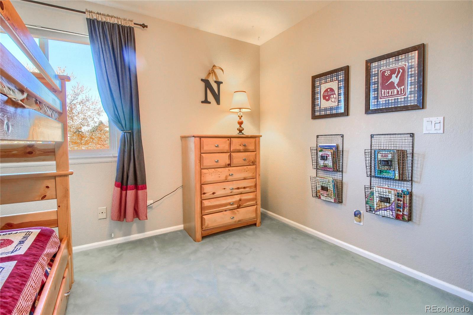8952 Tuscany Lane Highlands Ranch, CO 80130 - Photo 20 of 32 a view of walk in closet with clothes and shoes