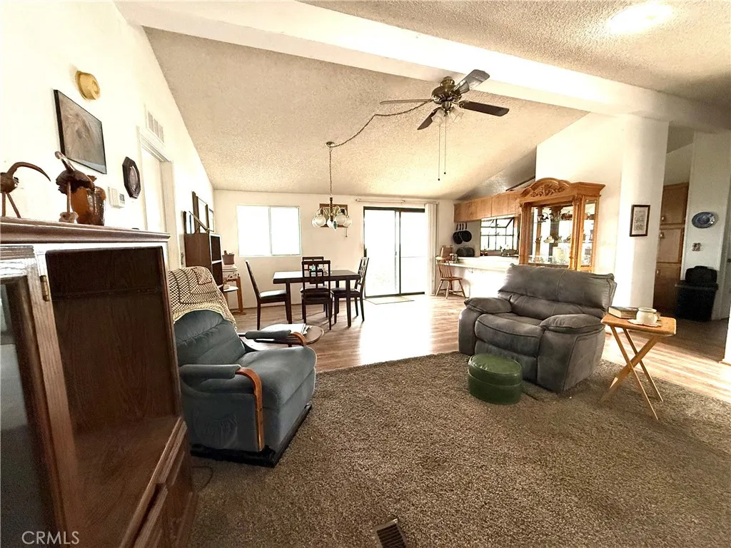 27250 Murrieta Road, Unit 51 Menifee, CA 92586 - Photo 15 of 43 a living room with furniture and a fireplace