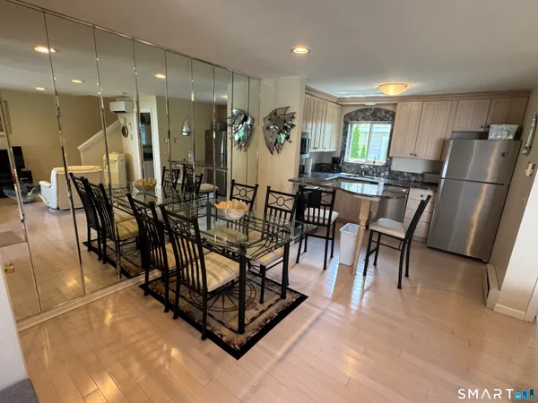 a room with lots of chairs and mirrors