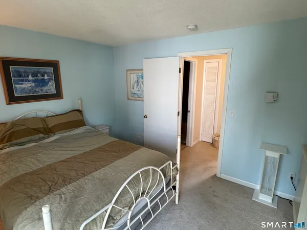 a bathroom with a sink toilet and mirror