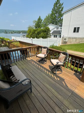 a view of a backyard with seating area