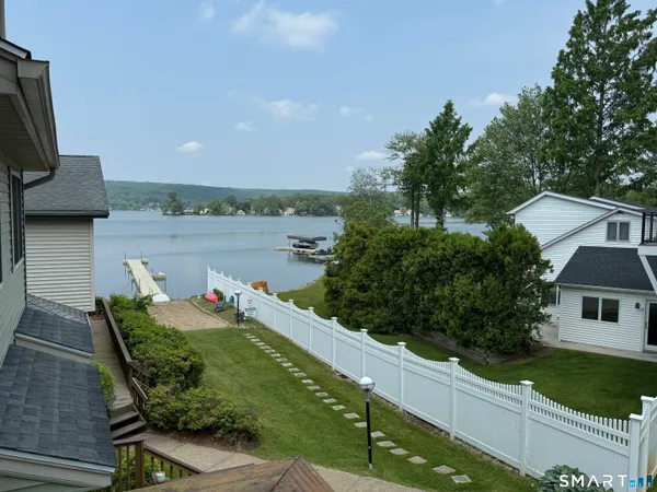 a view of a chairs and table in the patio