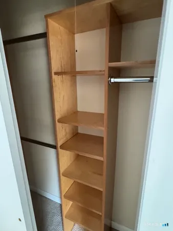 a view of small space with racks on the wall