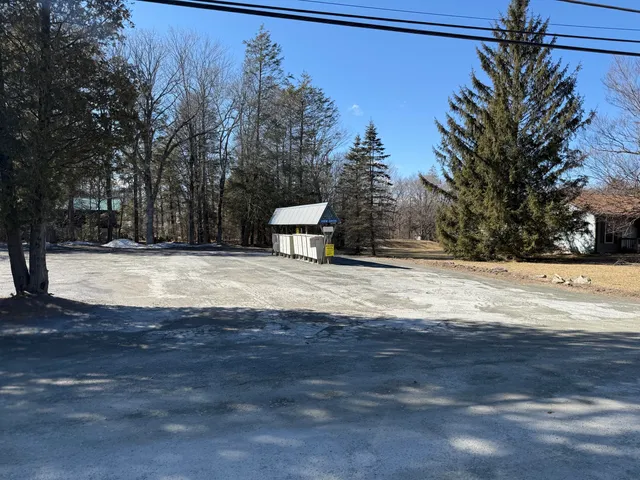 a view of pool with a yard