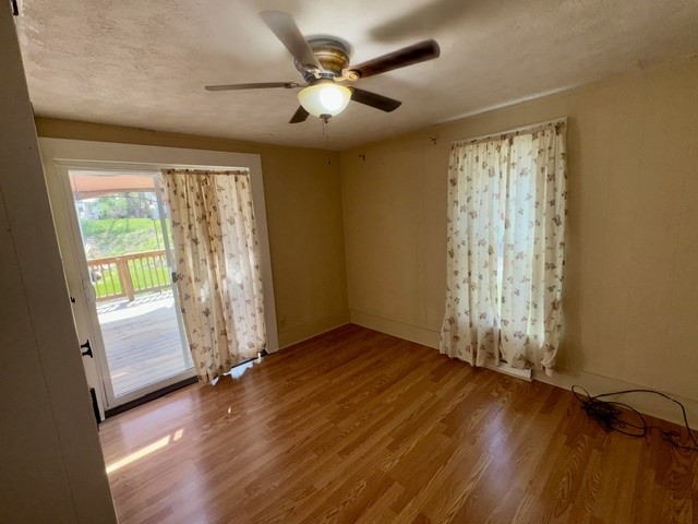 1701 West Jefferson Street Springfield, OH 45506 - Photo 12 of 18 This inviting room features warm wood flooring and convenient sliding doors leading to an outdoor deck.