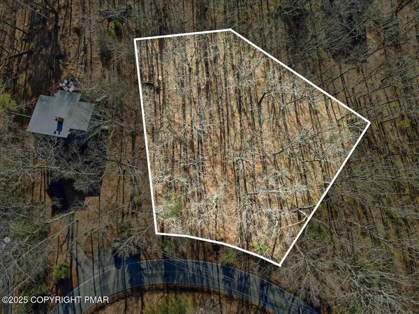 a view of a room with a sink and a mirror
