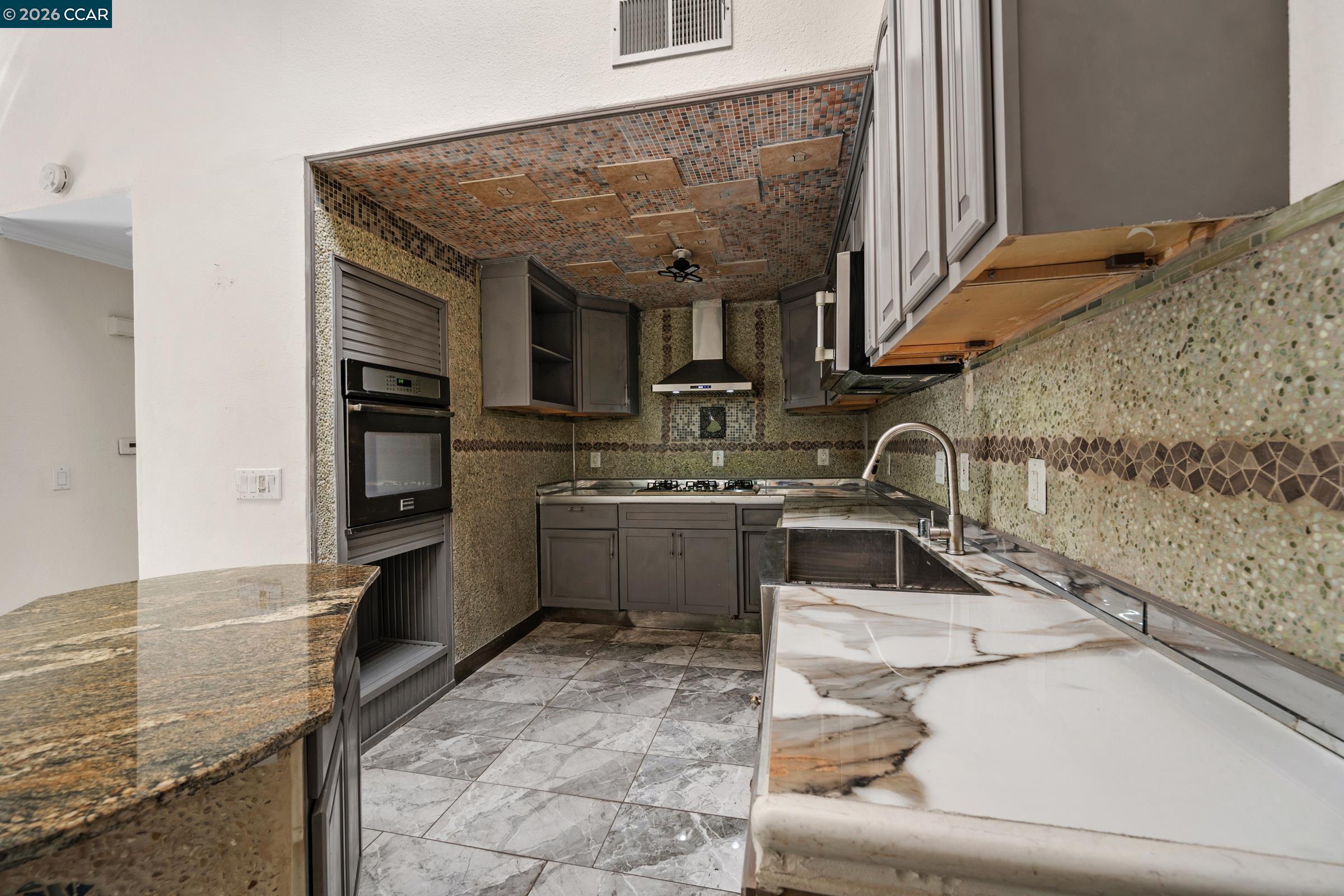 1544 Bailey Road, Unit 30 Concord, CA 94521 - Photo 10 of 33 a kitchen with stainless steel appliances granite countertop a sink stove and cabinets
