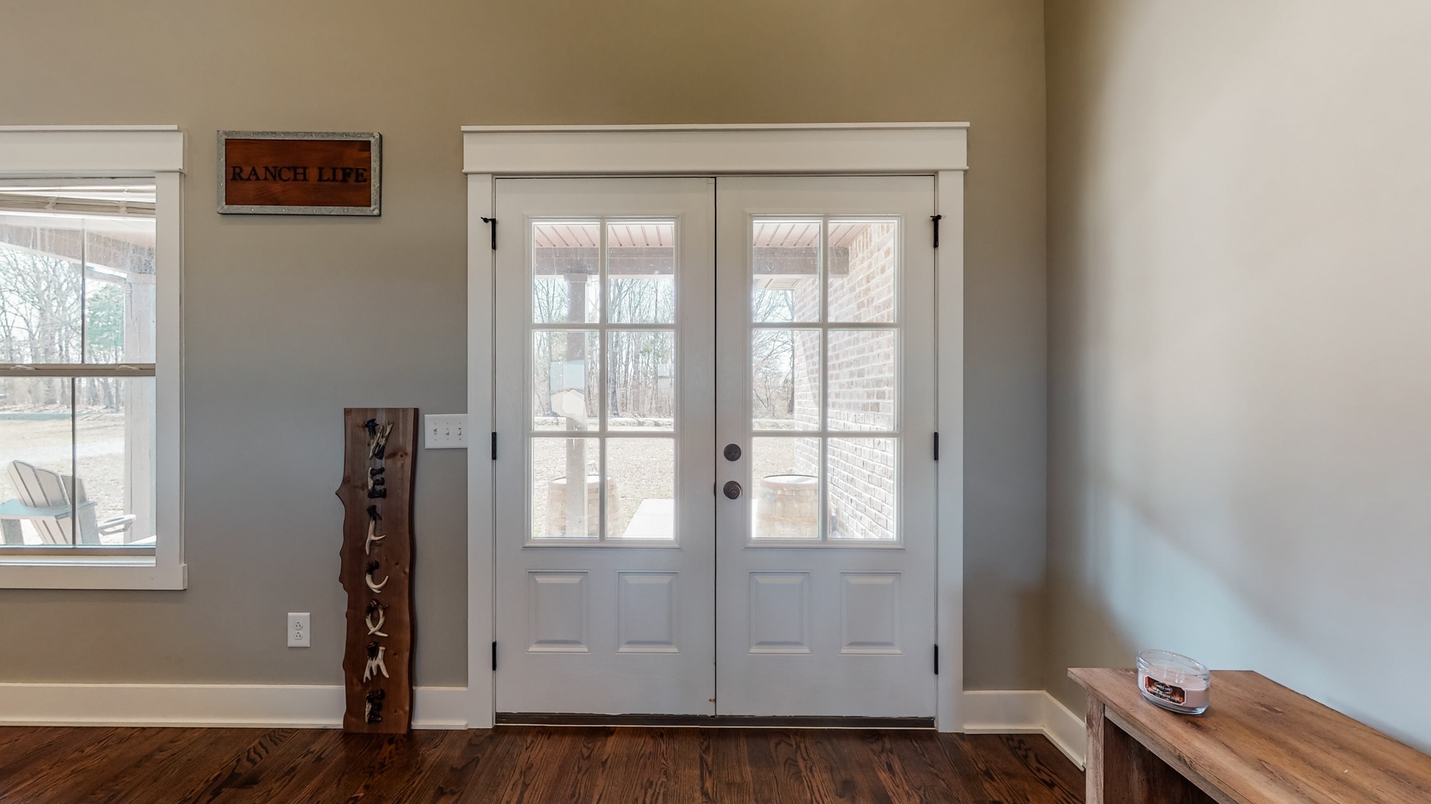 732 White Road Portland, TN 37148 - Photo 12 of 55 a view of an empty room with wooden floor and a window