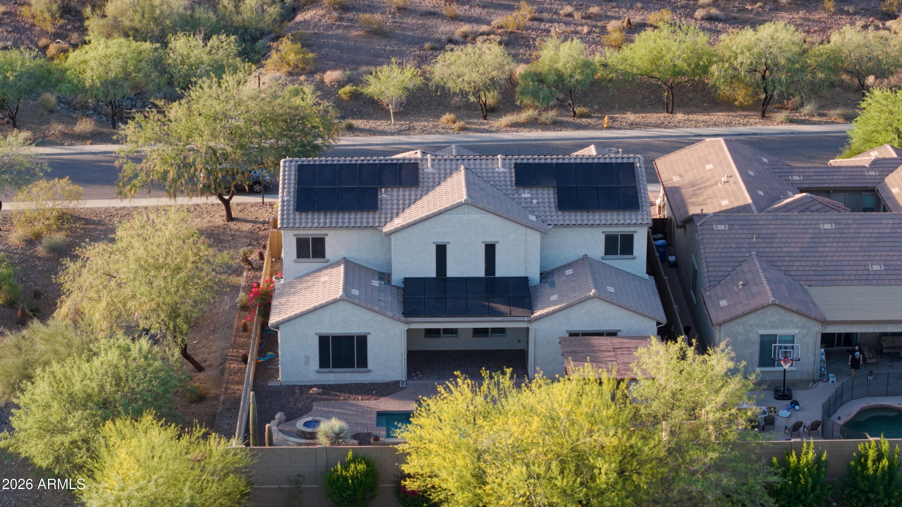 1615 West Red Fox Road Phoenix, AZ 85085 - Photo 61 of 64 aerial view of a house with a yard and potted plants