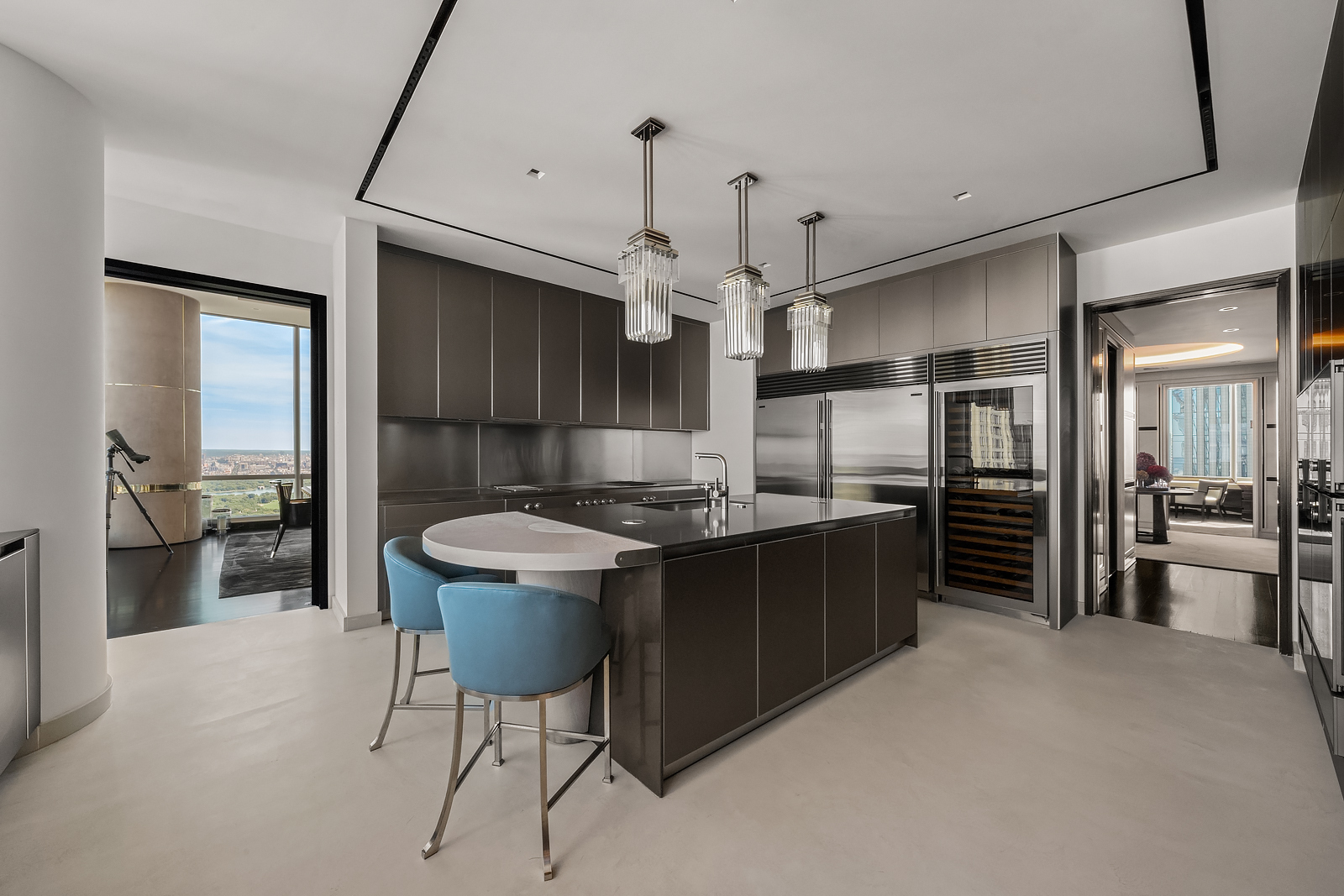 157 West 57th Street, Unit 64 Manhattan, NY 10019 - Photo 3 of 7 a kitchen with a table and chairs in it