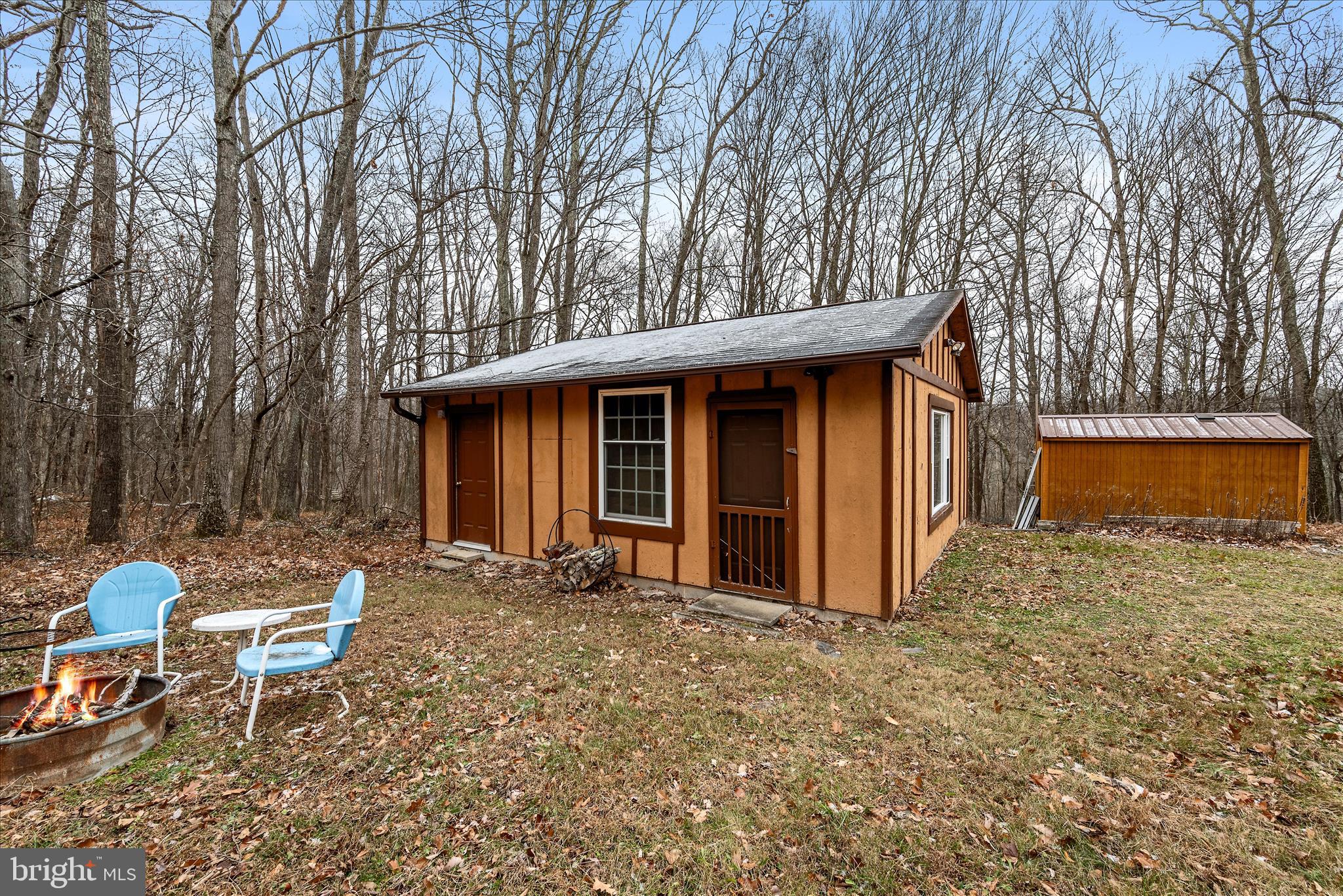 249 Crestview Lane Berkeley Springs, WV 25411 - Photo 28 of 52 a view of a house with backyard and sitting area