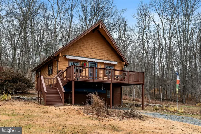 a view of a house with a yard and balcony