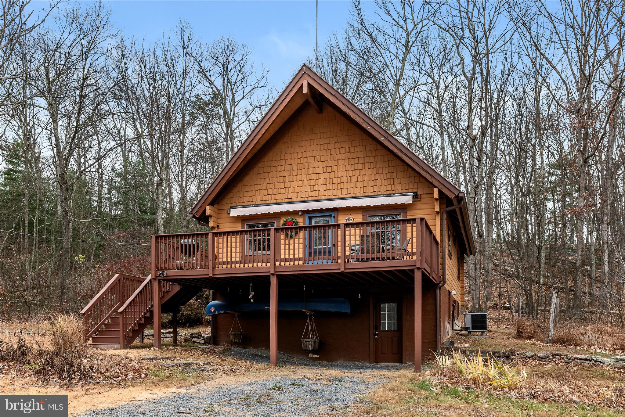 249 Crestview Lane Berkeley Springs, WV 25411 - Photo 37 of 52 a view of a house with a yard and balcony