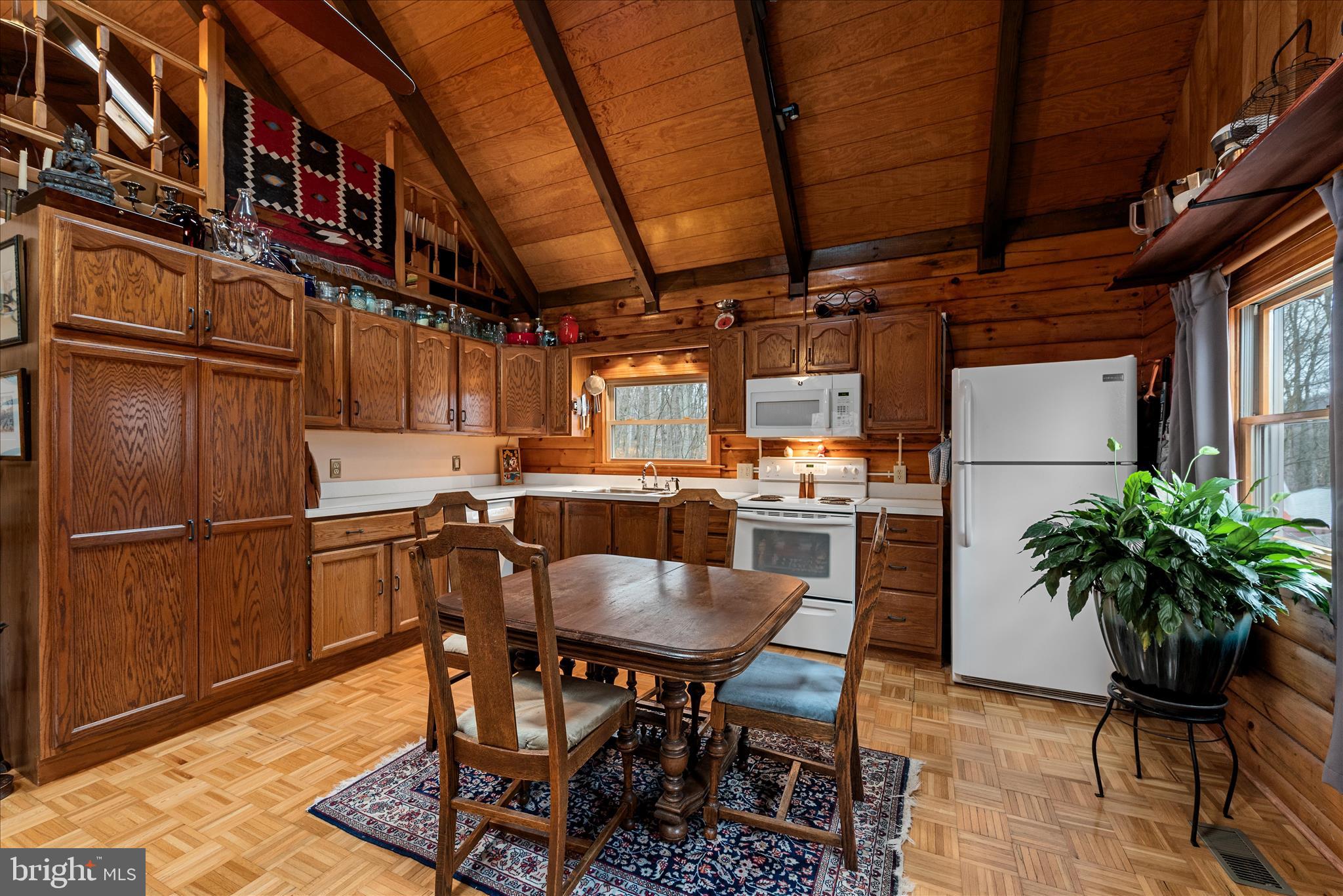 249 Crestview Lane Berkeley Springs, WV 25411 - Photo 5 of 52 a dining room with furniture and a kitchen view