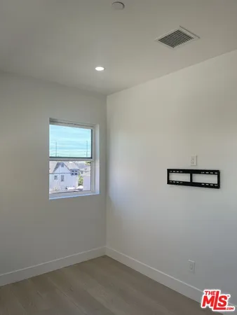 a spacious bathroom with a toilet sink and shower