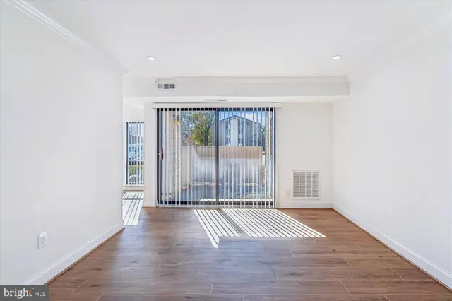 a view of wooden floor and brick walls