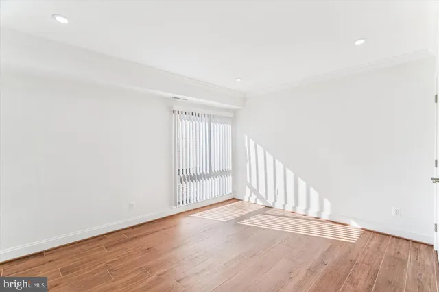 a view of a livingroom with wooden floor
