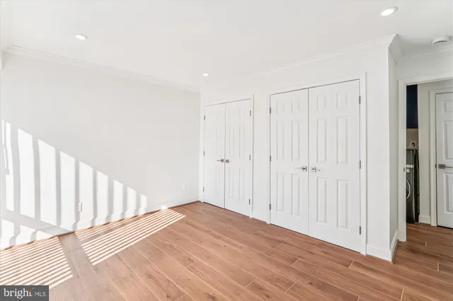a view of a room with wooden floor