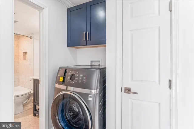 a view of a hallway with washer and dryer