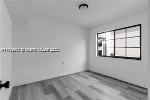 a view of a room that has a window in it