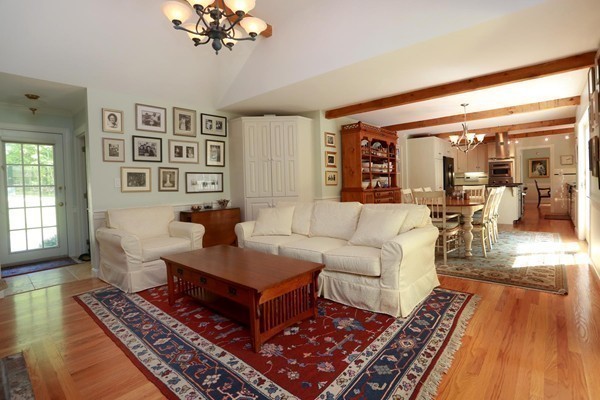 65 Boren Lane Boxford, MA 01921 - Photo 10 of 28 a living room with furniture and a chandelier