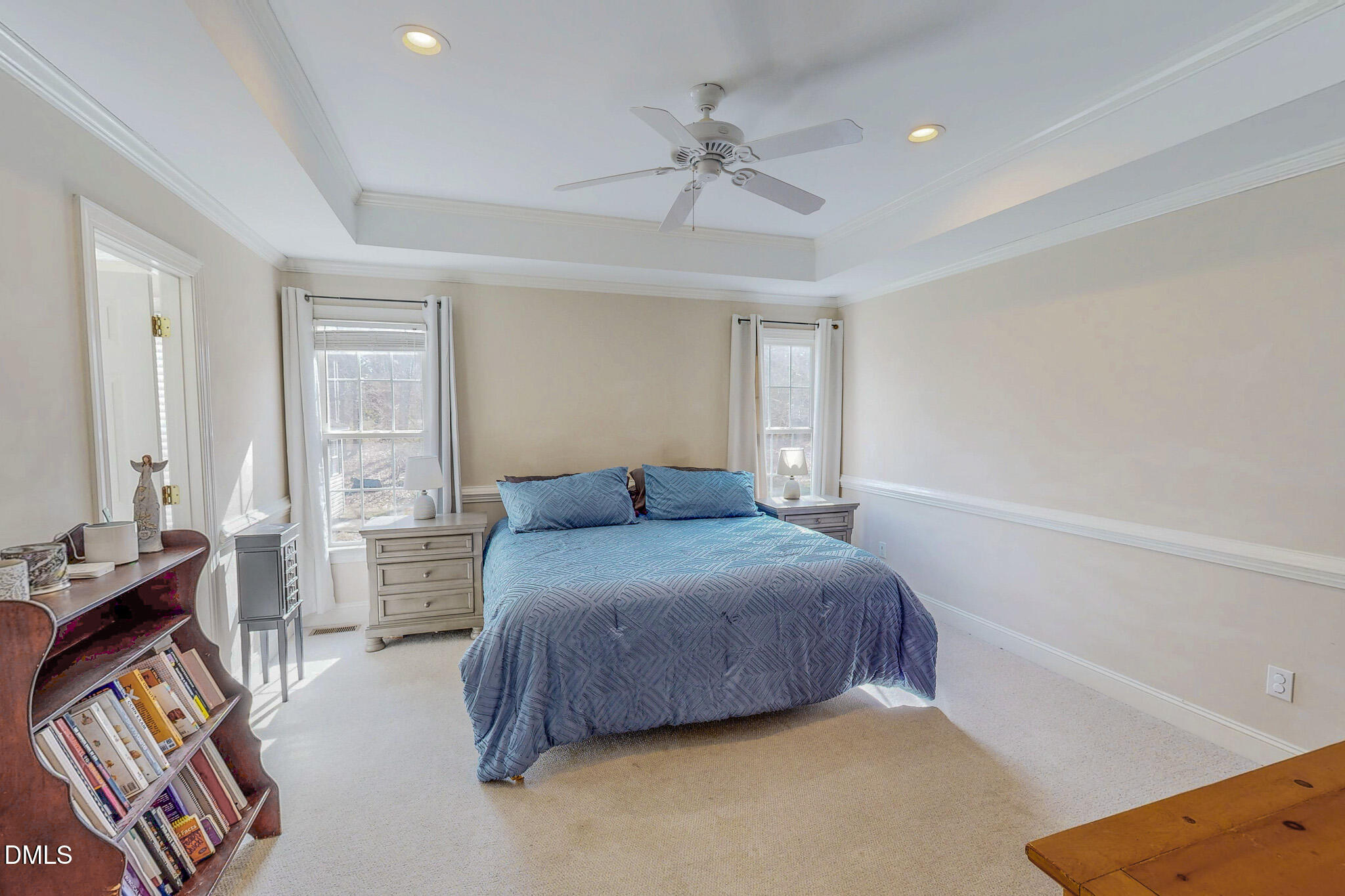 70 Younger Road Roxboro, NC 27573 - Photo 11 of 45 a bedroom with a bed and a chandelier