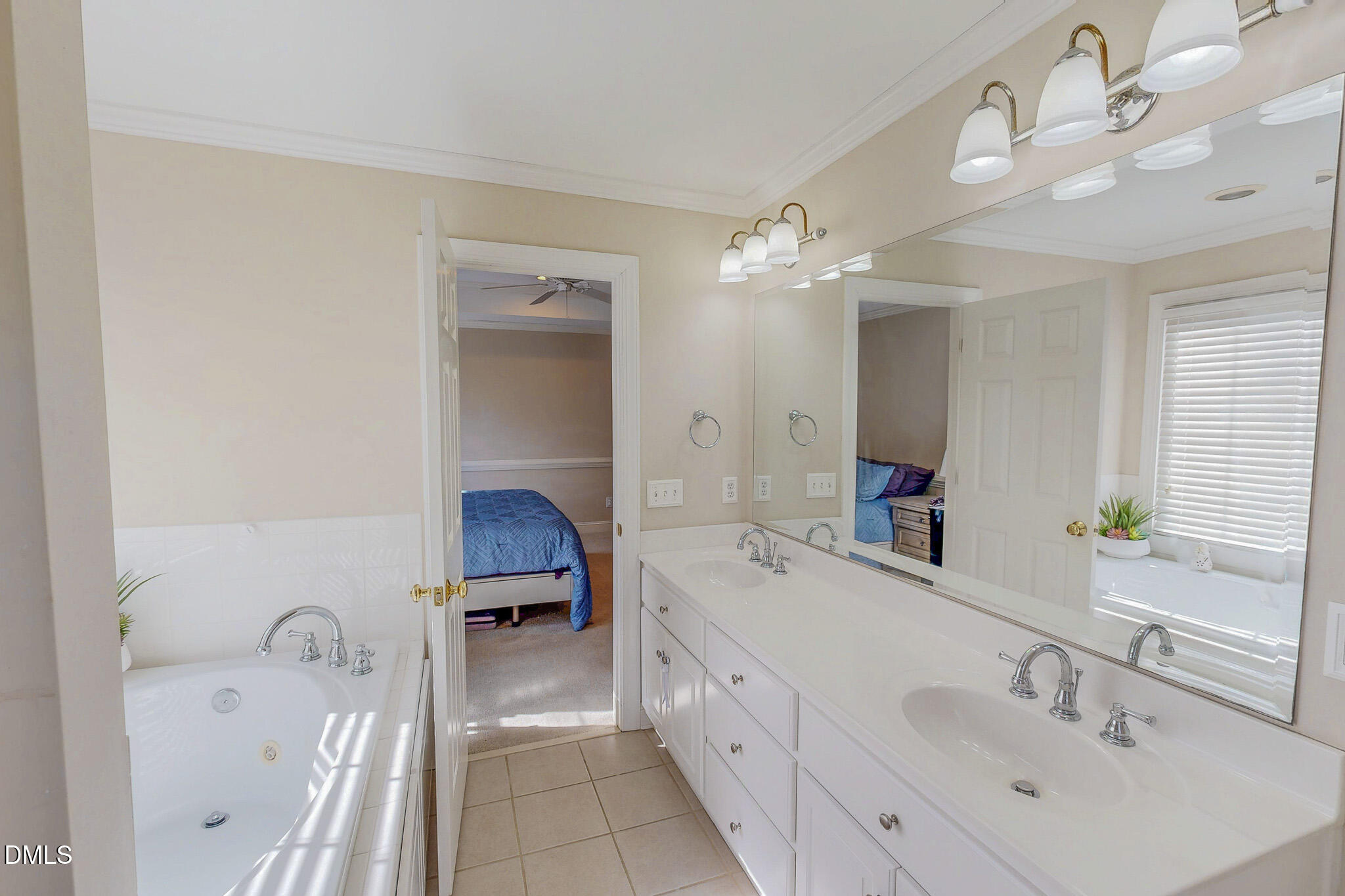 70 Younger Road Roxboro, NC 27573 - Photo 15 of 45 a en suite spacious bathroom with a tub double sink and mirror