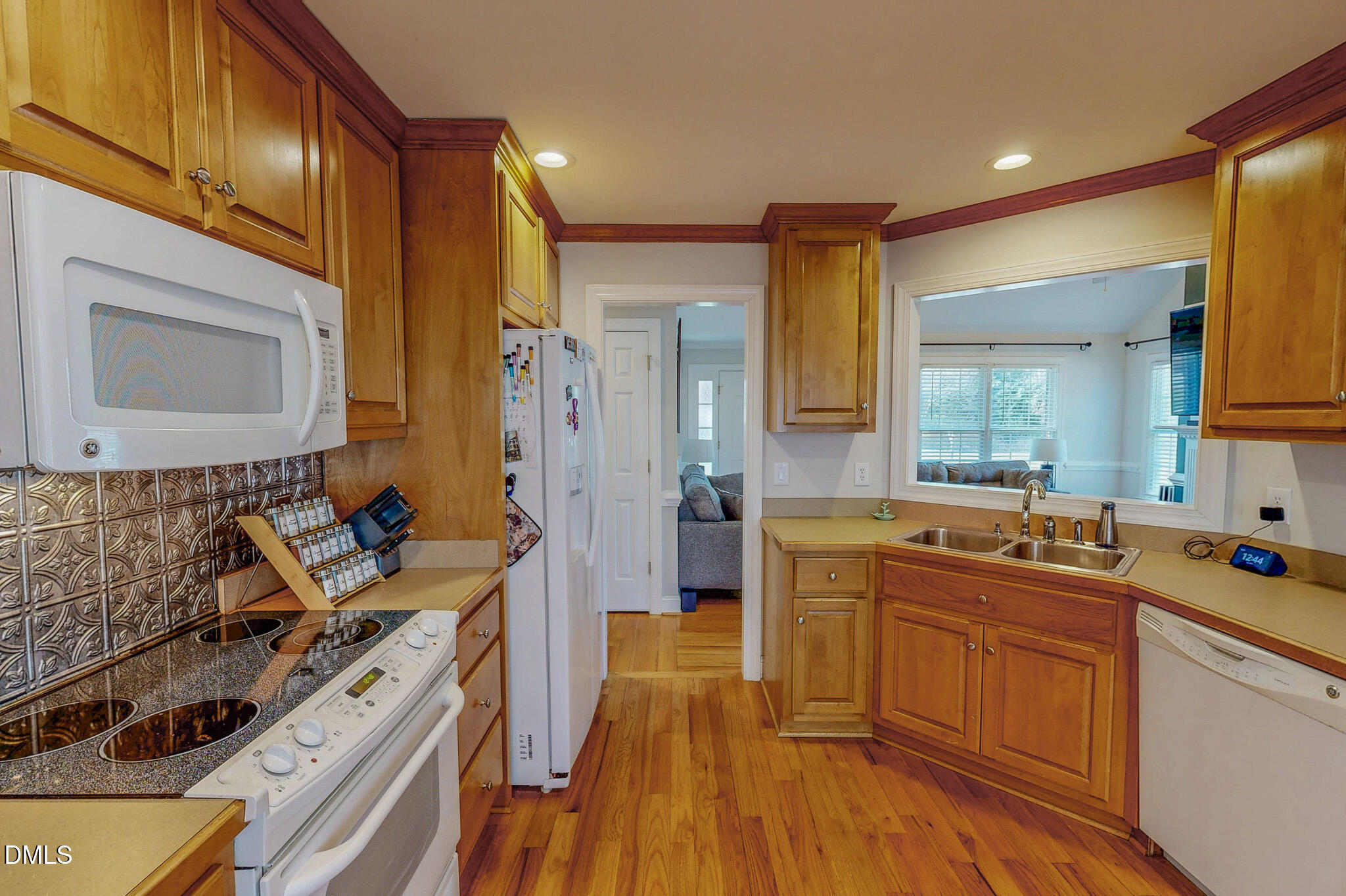70 Younger Road Roxboro, NC 27573 - Photo 23 of 45 a kitchen with a sink stove and wooden cabinets