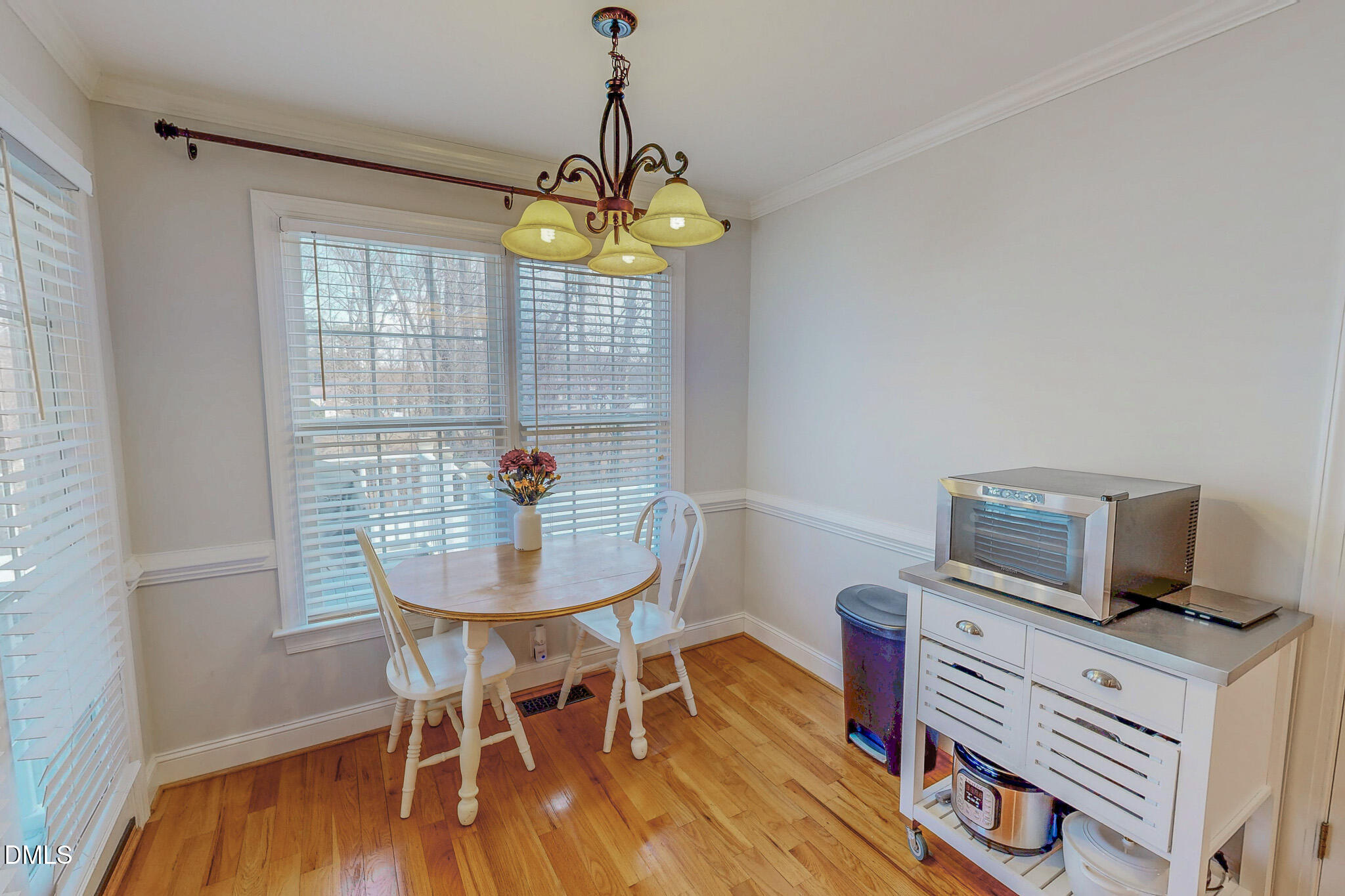 70 Younger Road Roxboro, NC 27573 - Photo 24 of 45 a view of a dining room with furniture wooden floor and chandelier