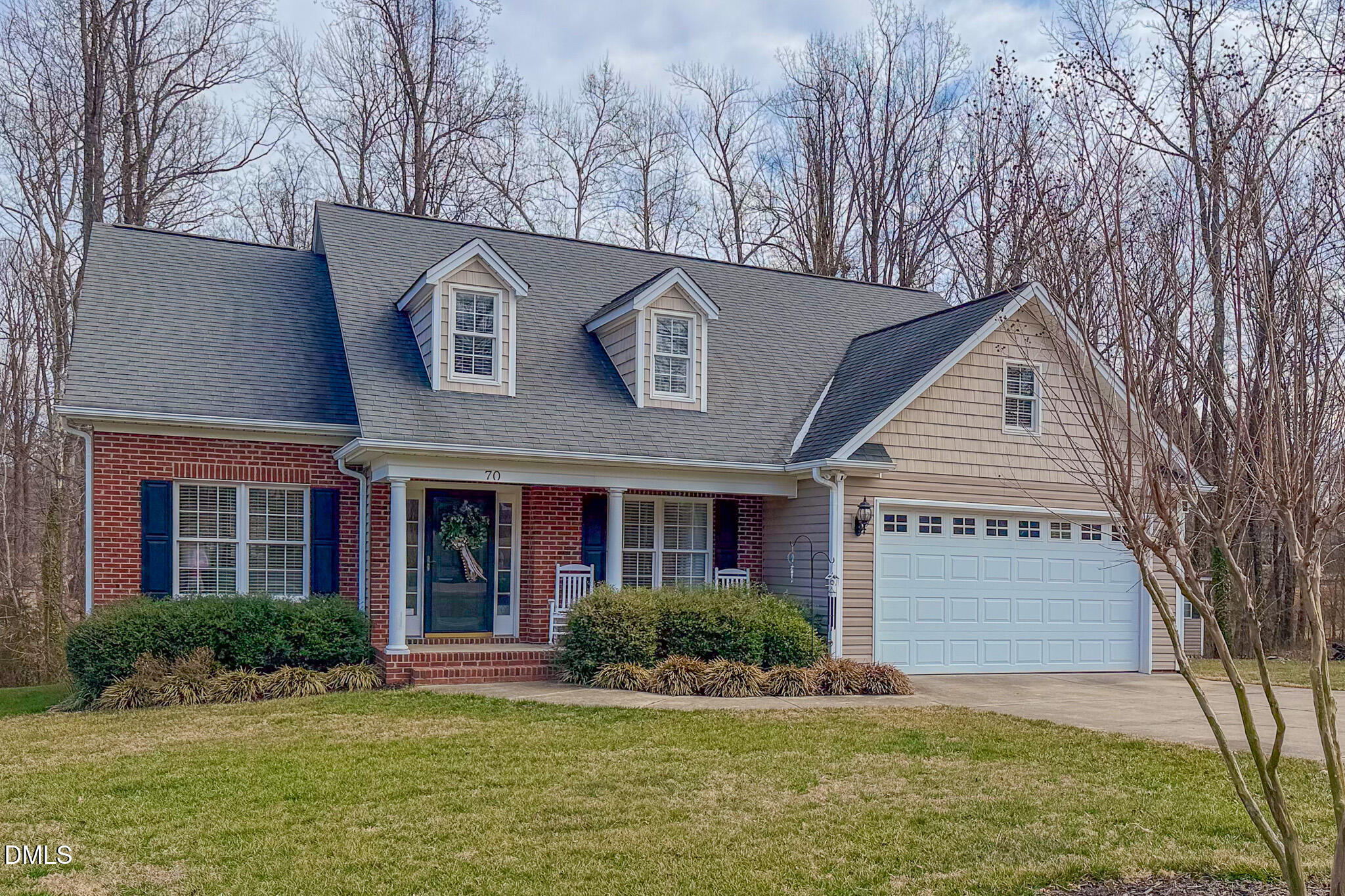 70 Younger Road Roxboro, NC 27573 - Photo 25 of 45 a front view of a house with a yard and garage