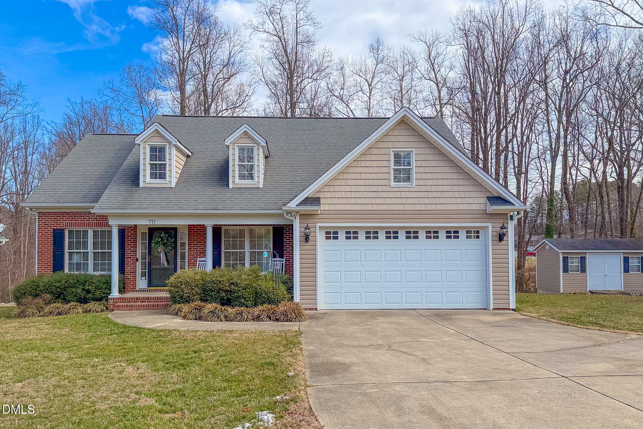 70 Younger Road Roxboro, NC 27573 - Photo 30 of 45 a front view of a house with a yard and garage