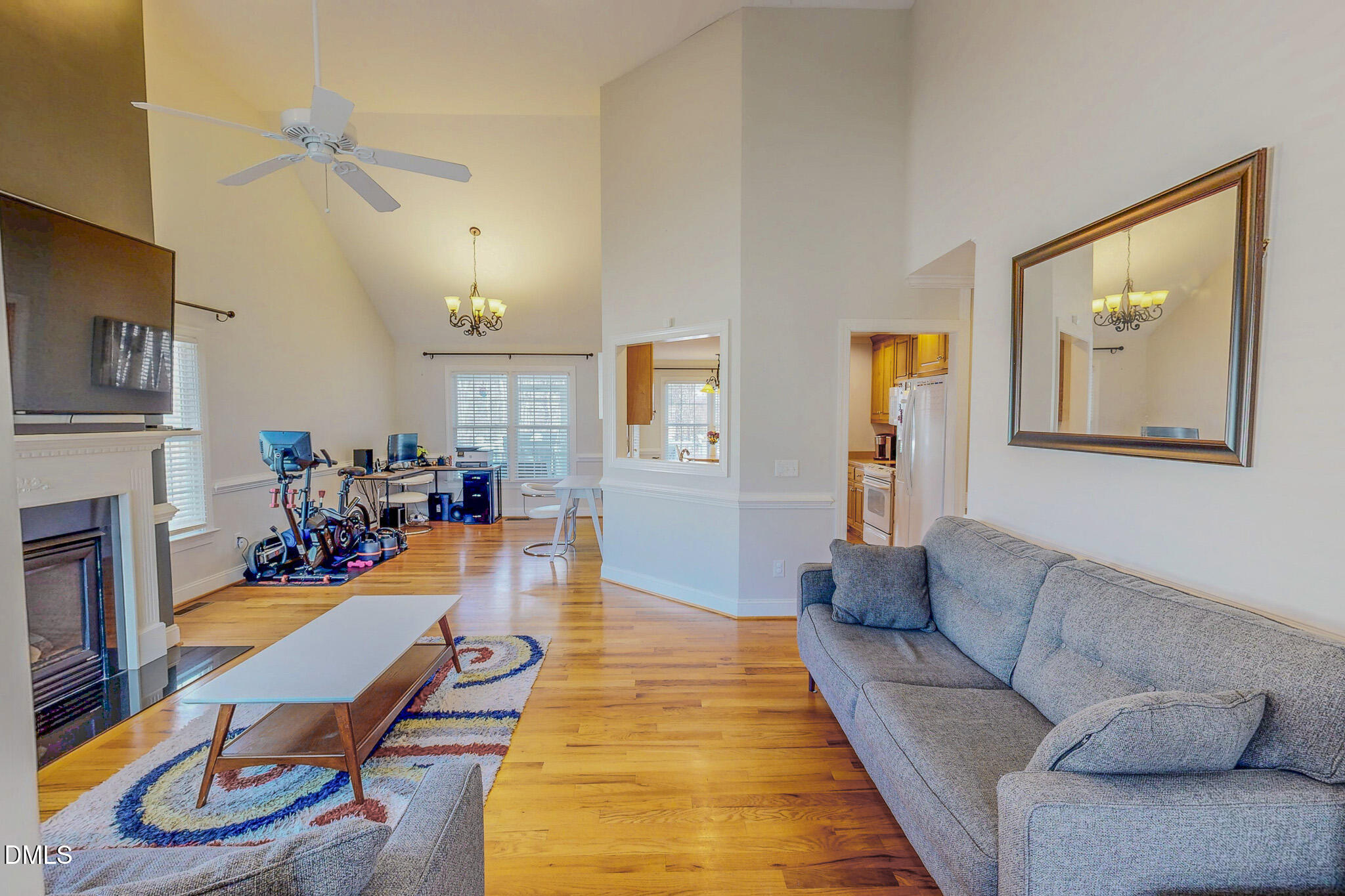 70 Younger Road Roxboro, NC 27573 - Photo 31 of 45 a living room with furniture a fireplace and a flat screen tv