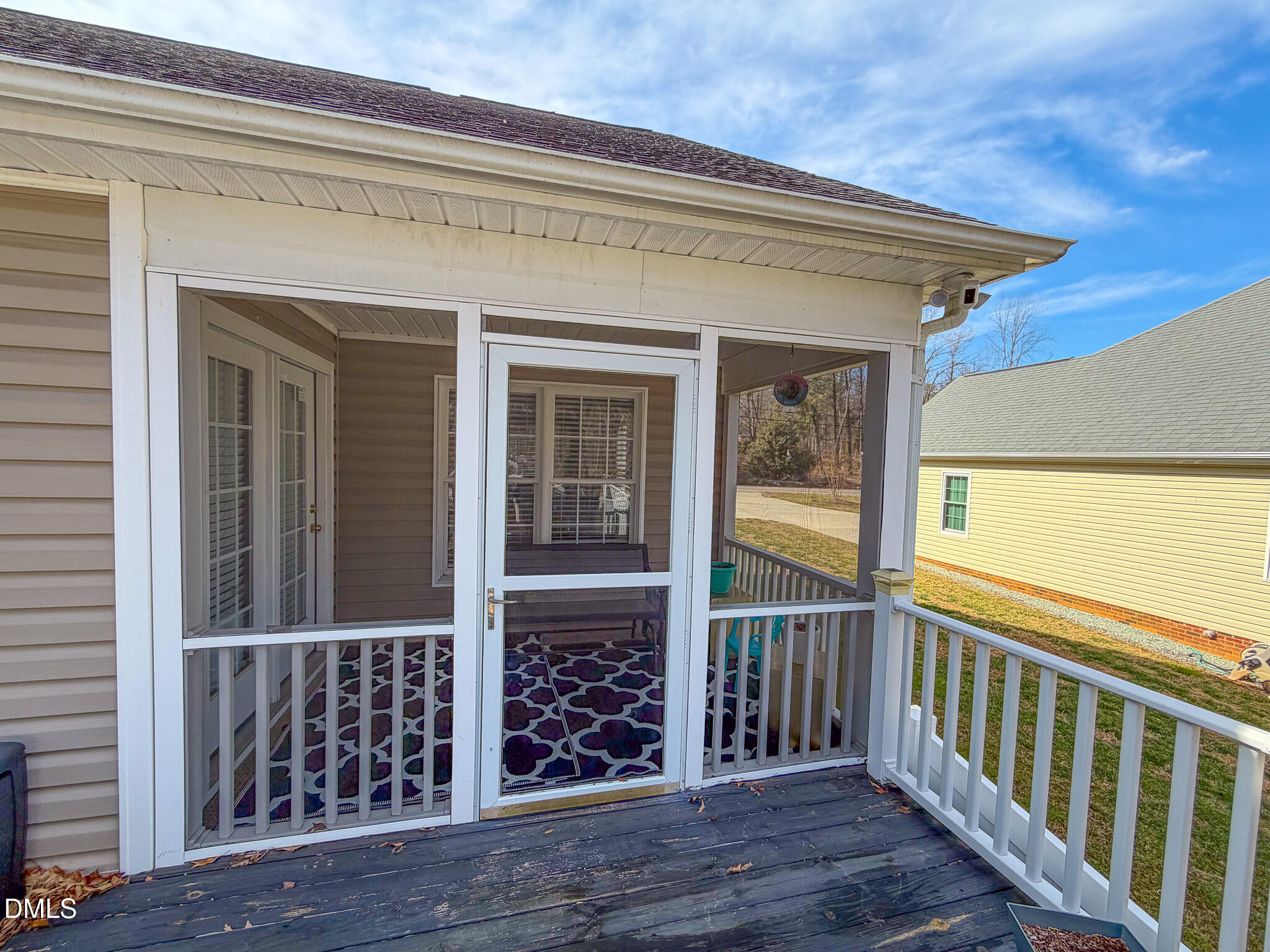 70 Younger Road Roxboro, NC 27573 - Photo 36 of 45 a view of a porch with wooden floor and floor to ceiling window