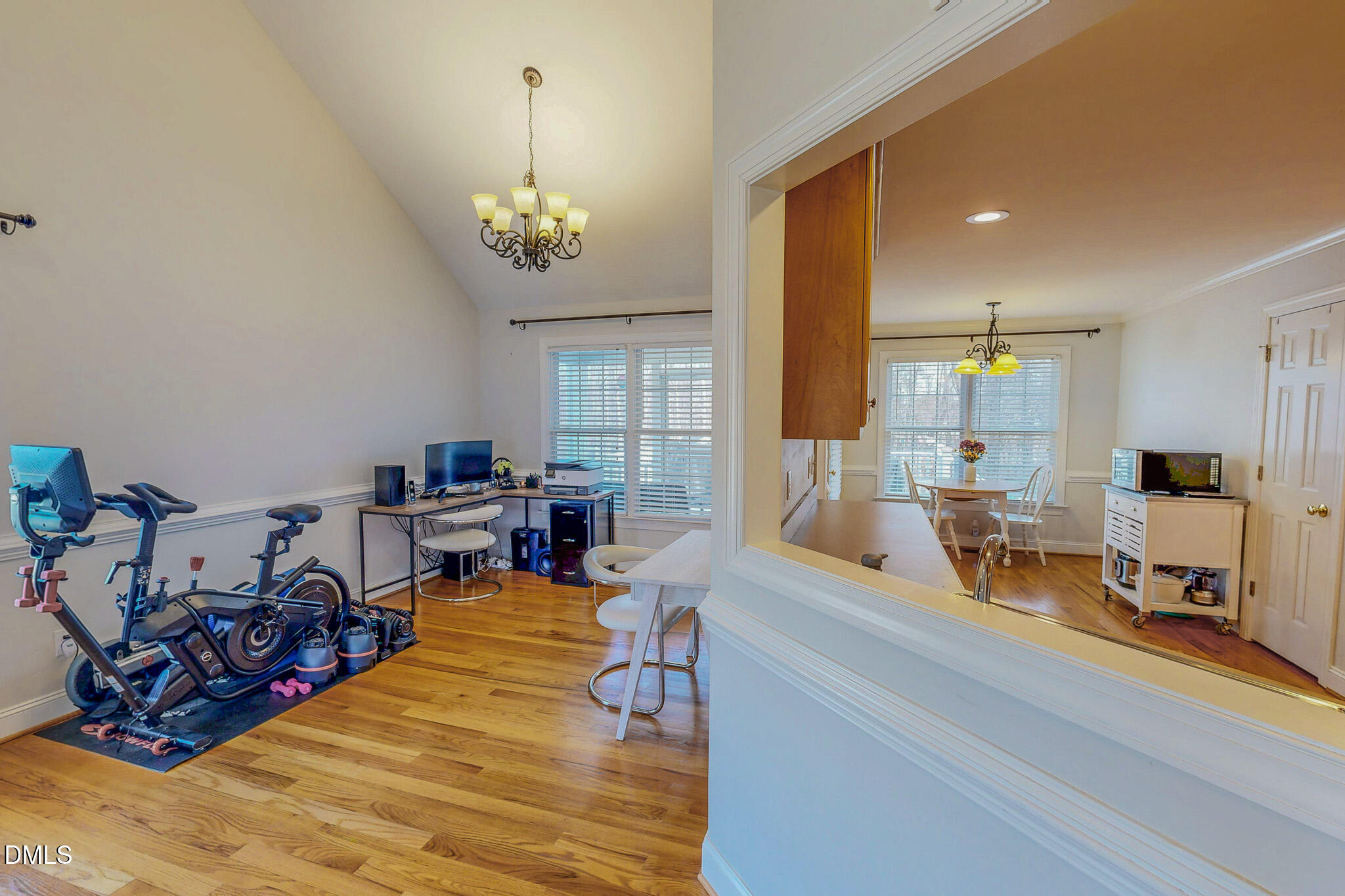 70 Younger Road Roxboro, NC 27573 - Photo 39 of 45 a living room with furniture a chandelier and a view of kitchen