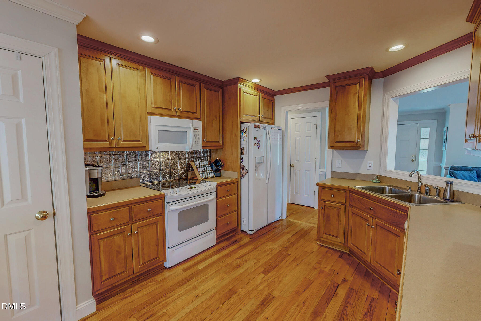 70 Younger Road Roxboro, NC 27573 - Photo 4 of 45 a kitchen with a refrigerator stove top oven and sink