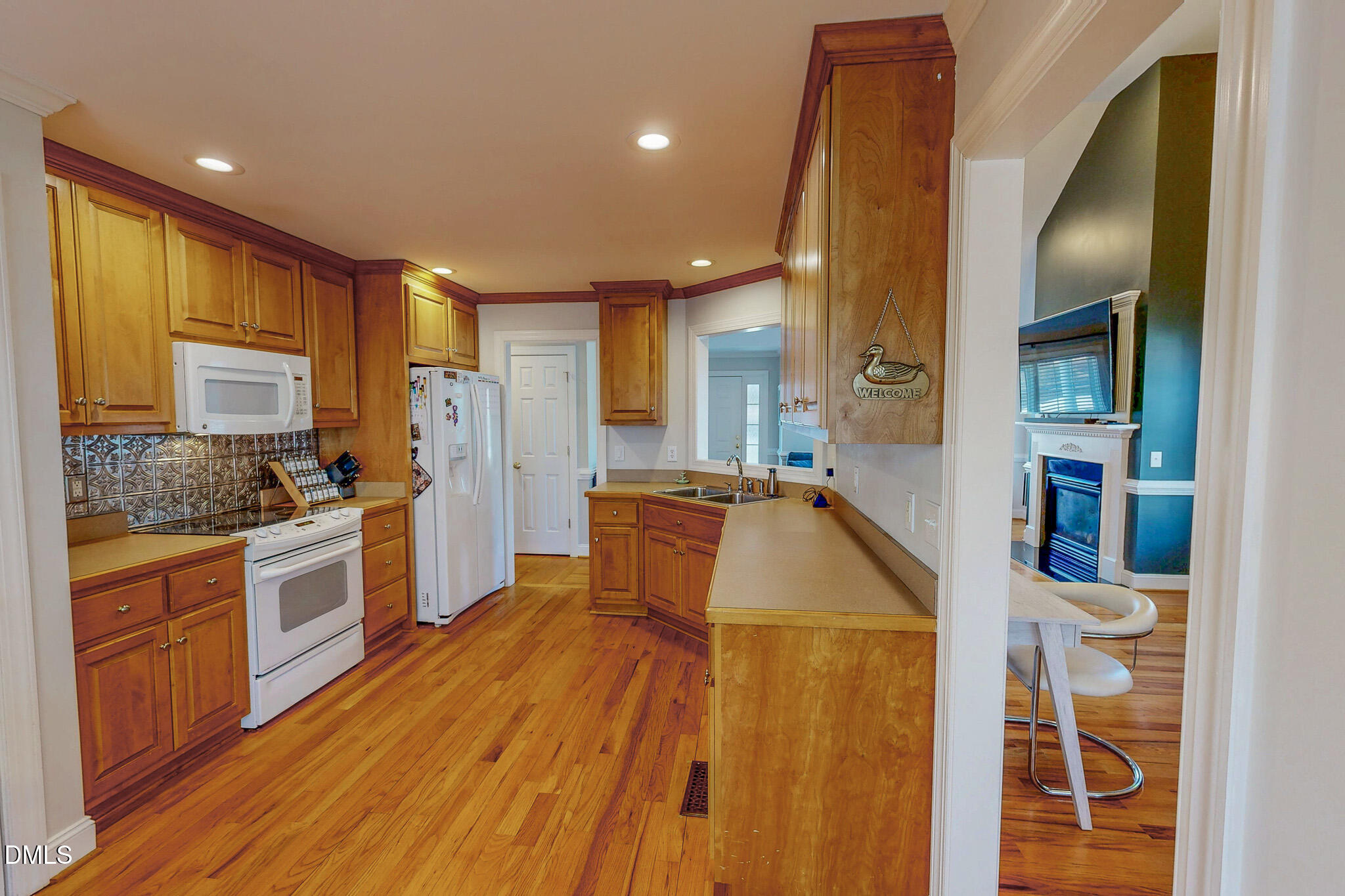 70 Younger Road Roxboro, NC 27573 - Photo 41 of 45 a large kitchen with stainless steel appliances a large counter top a stove and a refrigerator