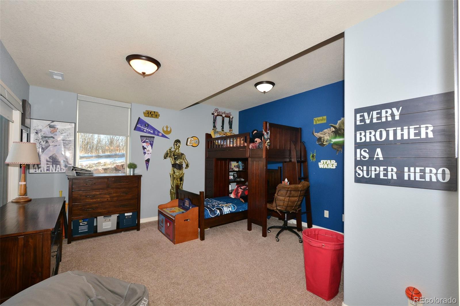 4525 Sandstone Road Monument, CO 80132 - Photo 36 of 40 a bedroom with furniture and a fan