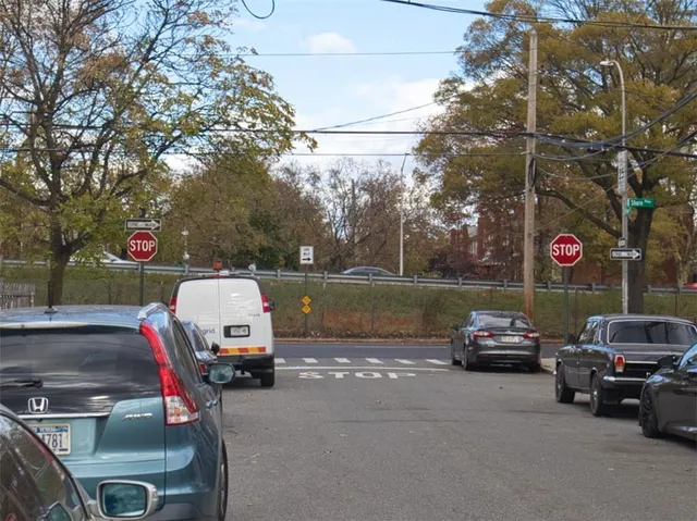 a view of a street with cars
