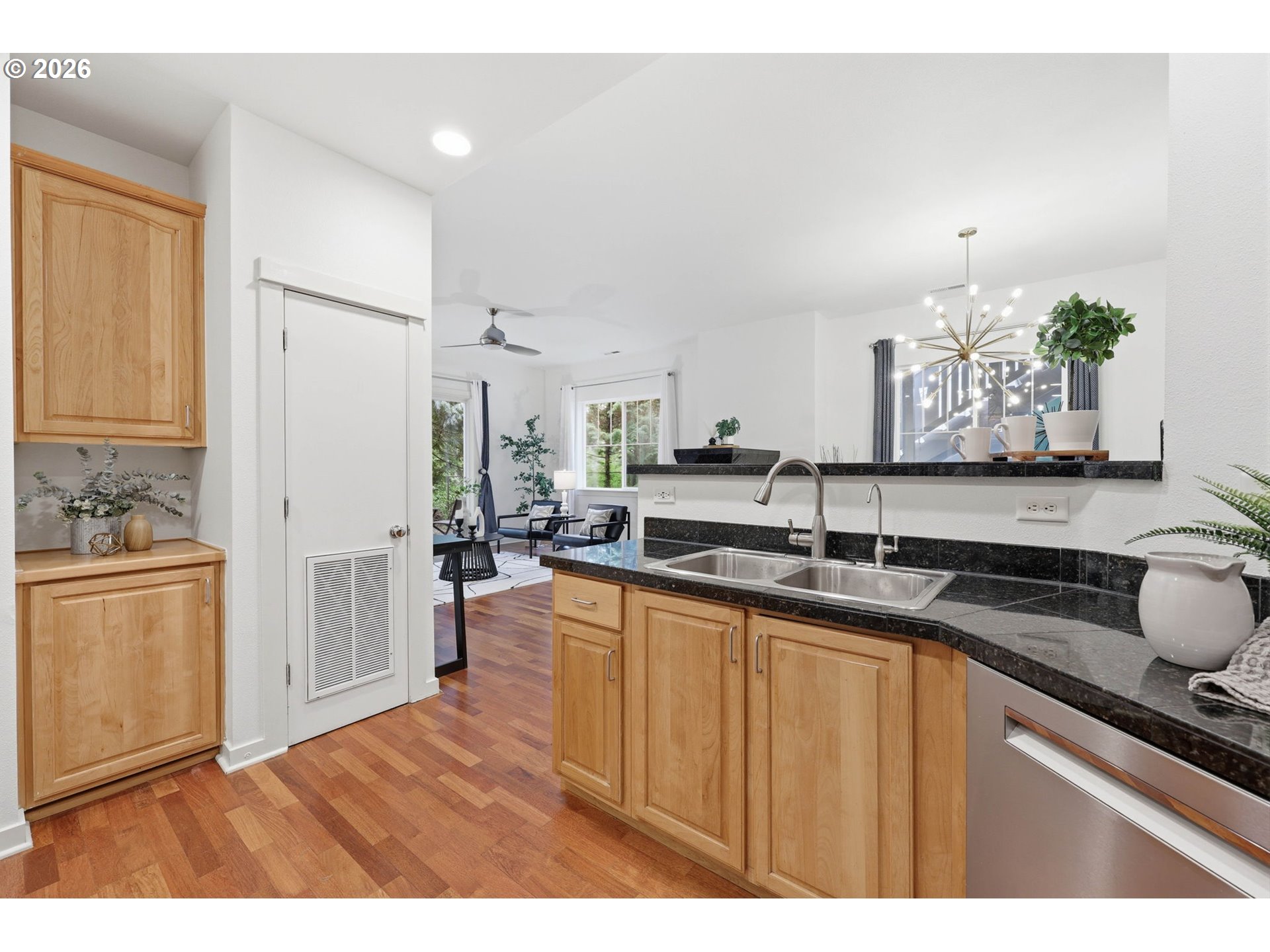8361 Southwest 24th Avenue Portland, OR 97219 - Photo 15 of 39 a kitchen with granite countertop a sink stainless steel appliances and cabinets