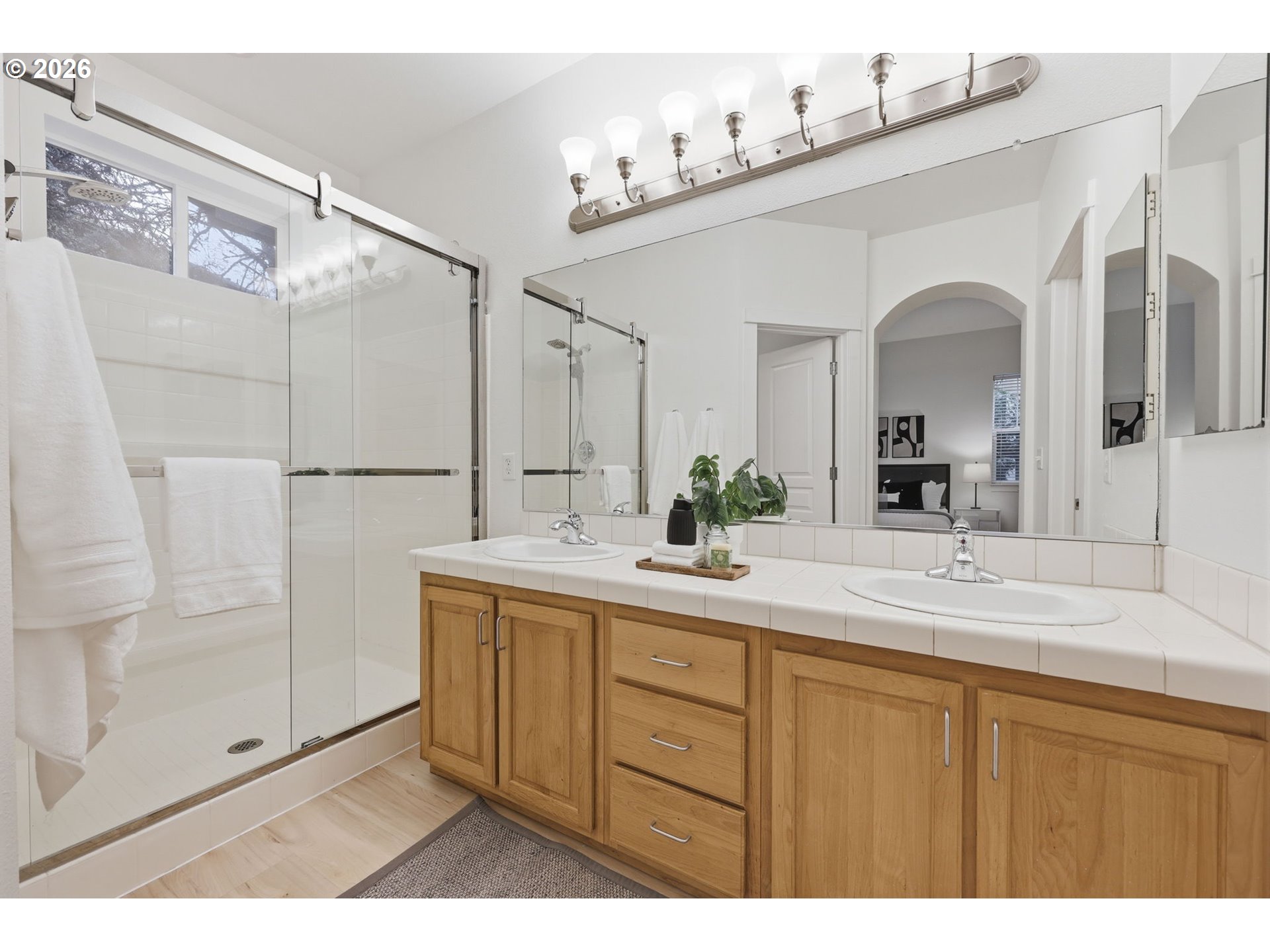 8361 Southwest 24th Avenue Portland, OR 97219 - Photo 21 of 39 a bathroom with a sink and a mirror
