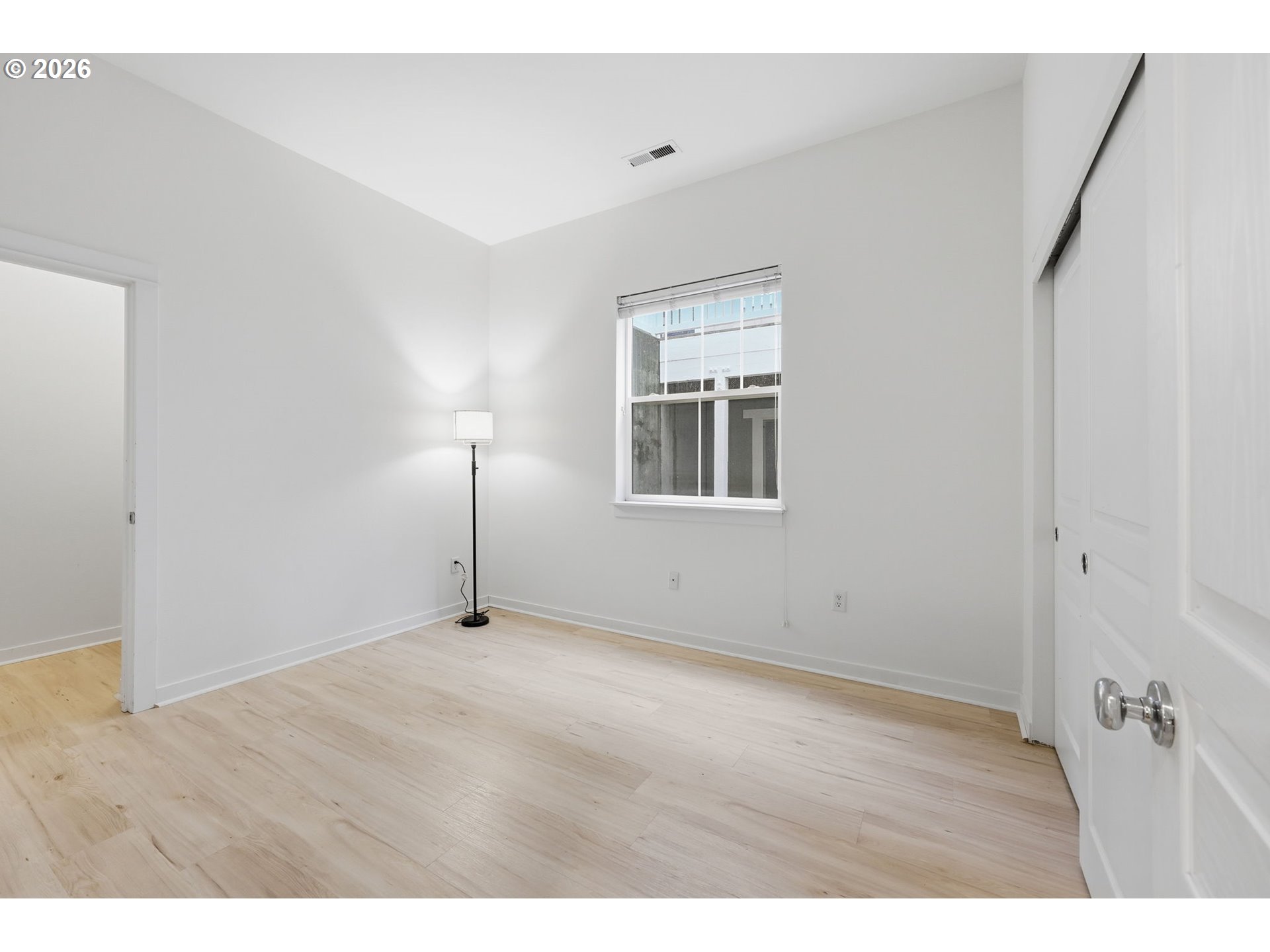 8361 Southwest 24th Avenue Portland, OR 97219 - Photo 23 of 39 a view of an empty room with wooden floor