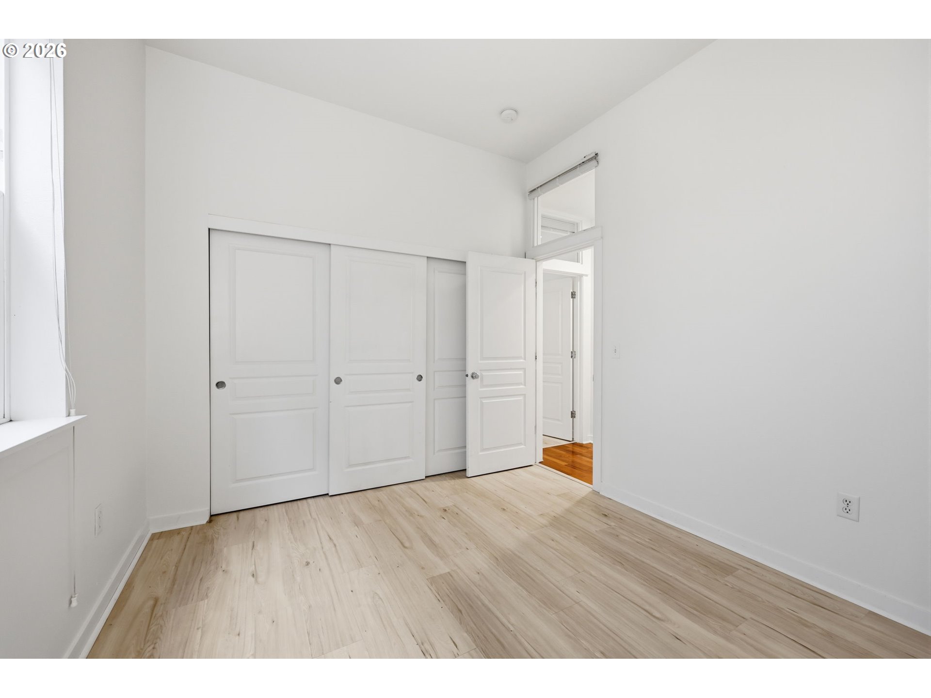 8361 Southwest 24th Avenue Portland, OR 97219 - Photo 24 of 39 a empty room with wooden floor