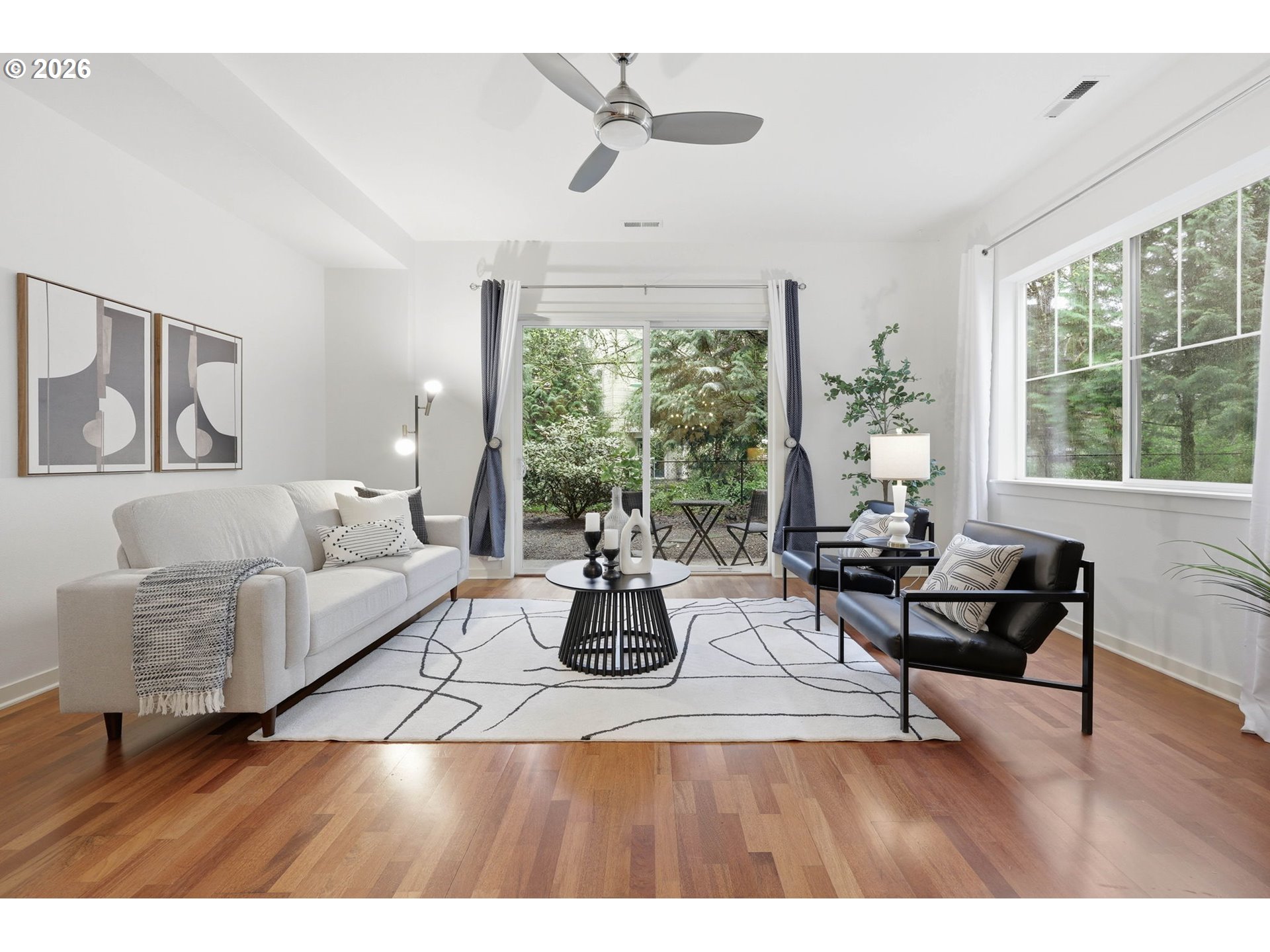 8361 Southwest 24th Avenue Portland, OR 97219 - Photo 7 of 39 a living room with furniture and large windows