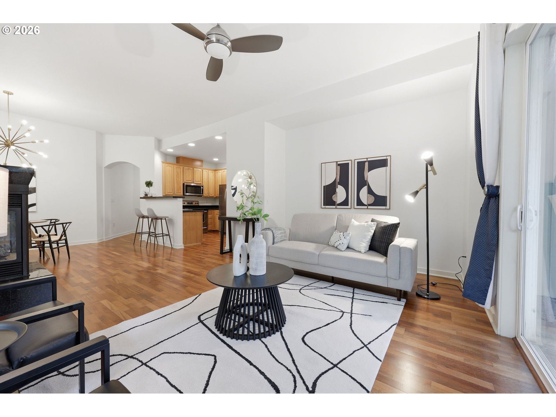 8361 Southwest 24th Avenue Portland, OR 97219 - Photo 9 of 39 a living room with furniture and a flat screen tv