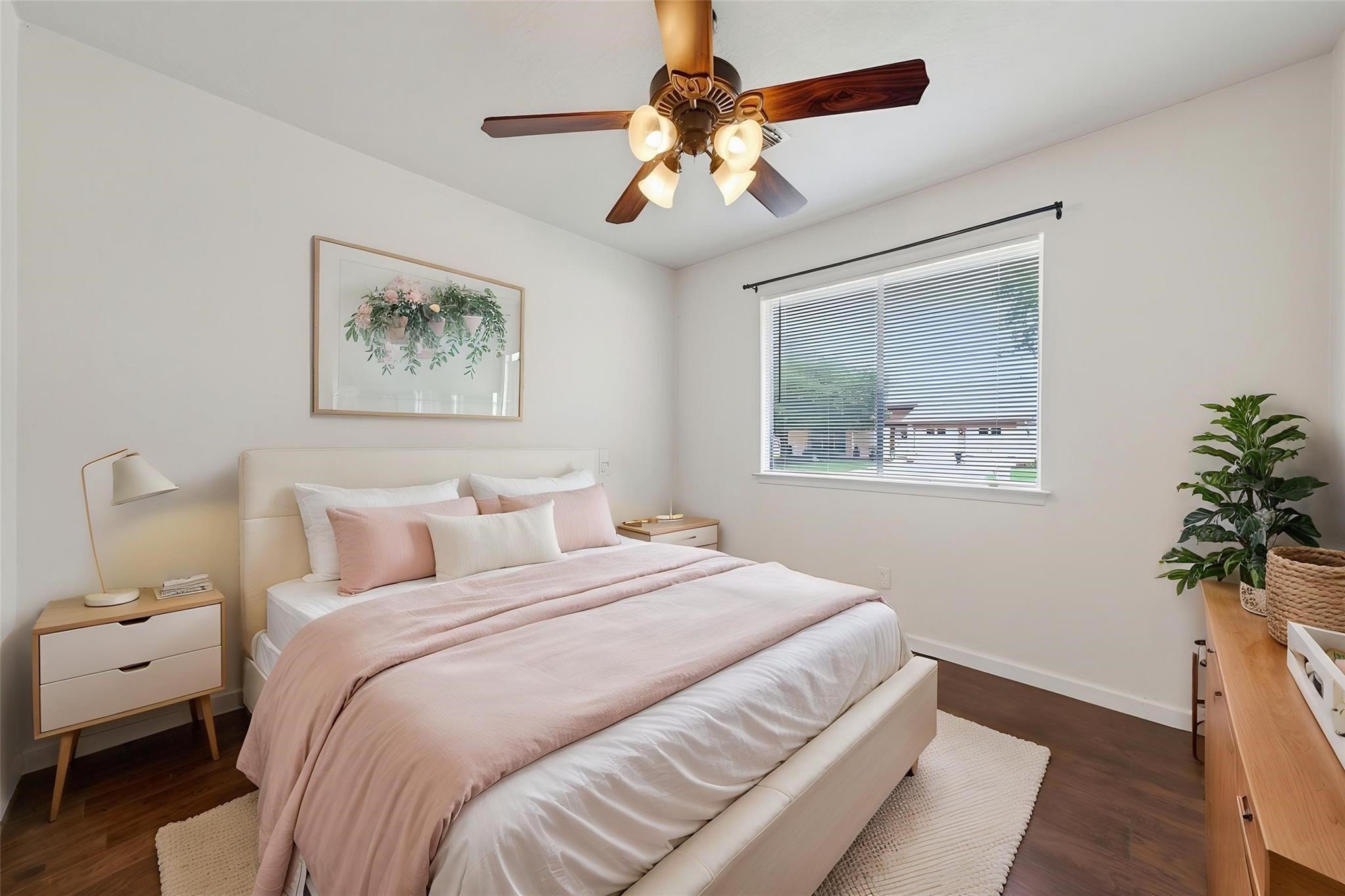 17002 Dew Drop Lane Houston, TX 77095 - Photo 15 of 24 a bedroom with bed painting on the wall and a potted plant