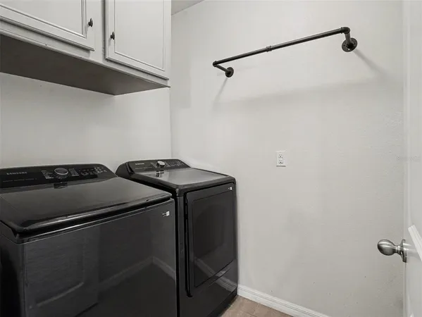 a view of a room with furniture and a rug