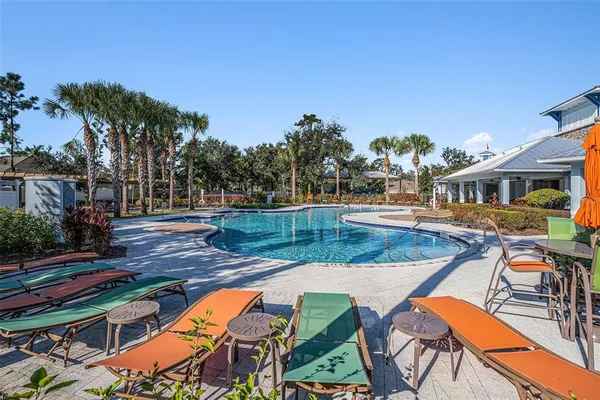 a view of swimming pool with chairs