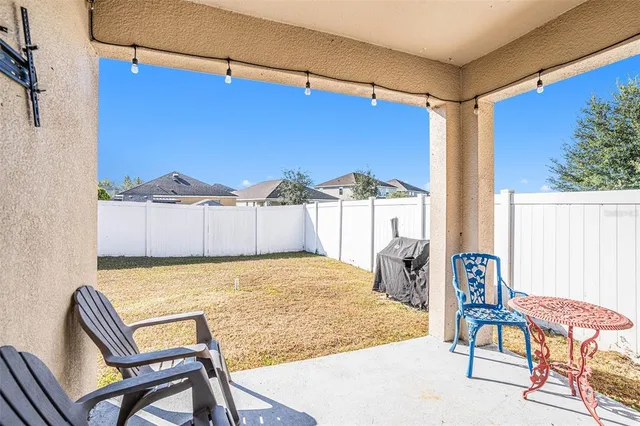 a view of a room with furniture and a rug