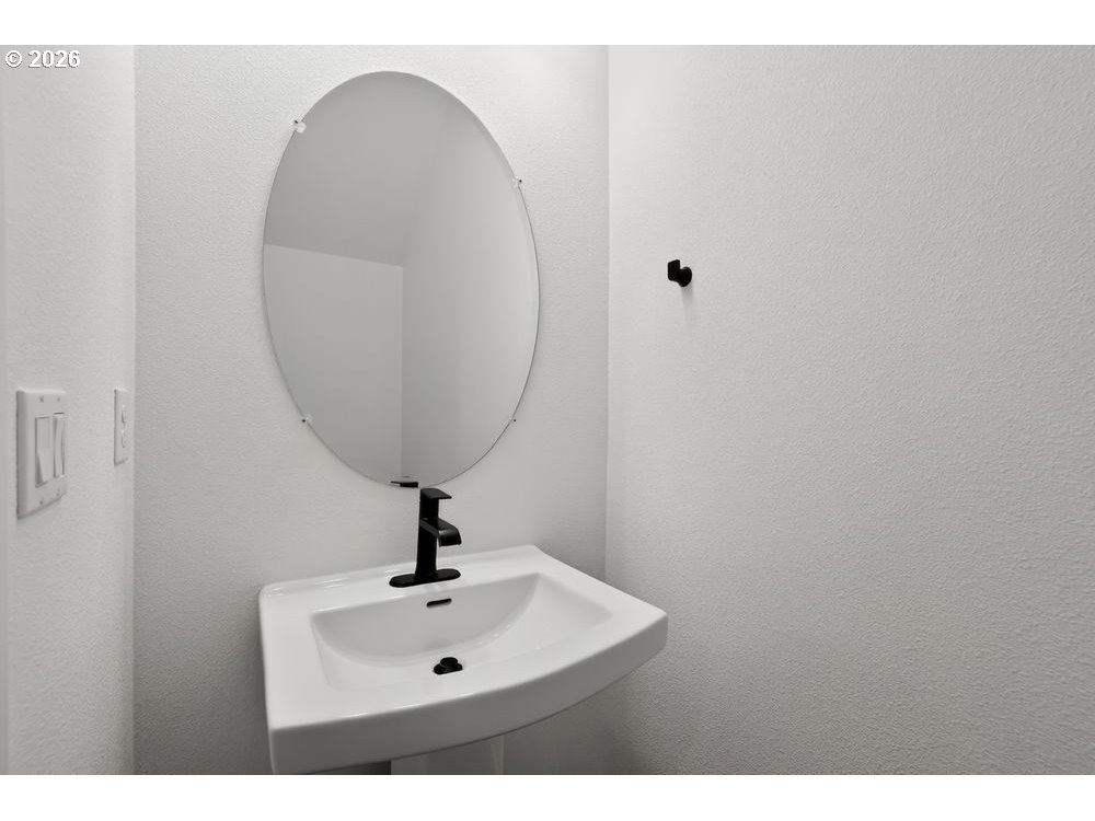 3704 Southwest 40th Street Gresham, OR 97080 - Photo 13 of 27 a bathroom with a sink and mirror
