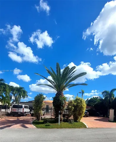 a view of a street with a building in the background
